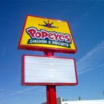 Tall sign outside of Popeyes Chicken & Biscuits Restaurant