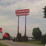 Tall Farmstead Restaurant sign designed to see from freeway